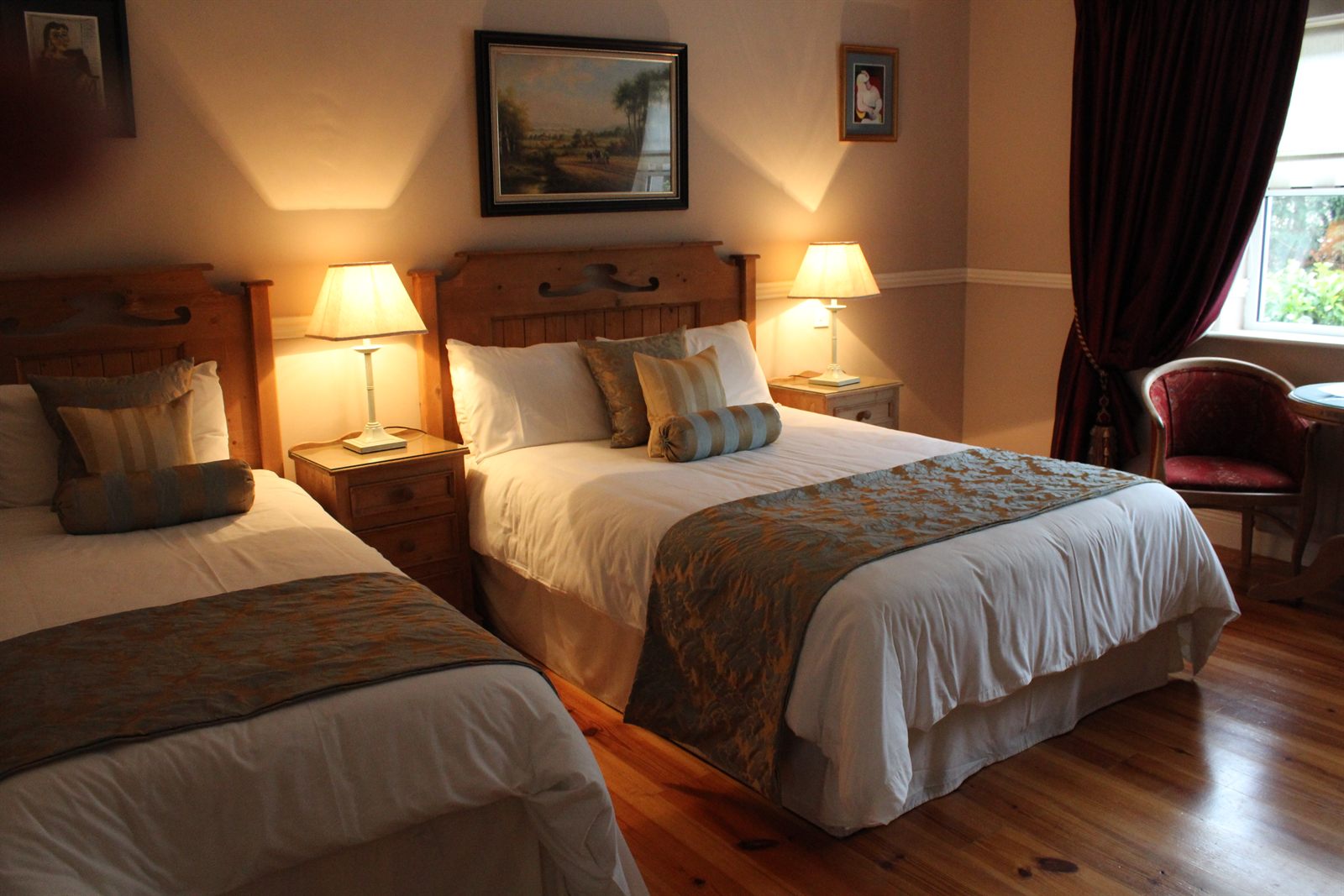 Twin room with two single beds and a bay window